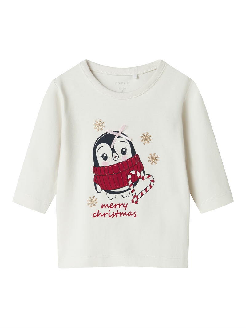 Cremehvid Name It julebluse med pingvin, slikstok og Merry Christmas tekst set forfra