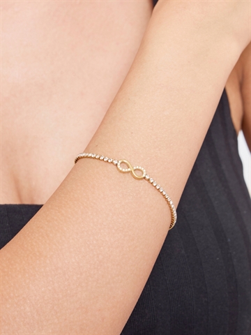 Infinity armbånd i guld med sten set forfra